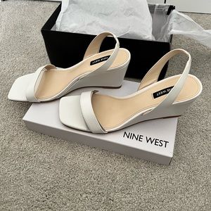 Nine West sandals, size 9.5. White wedge style with strap.